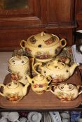 Collection of Aynsley Orchard Gold including soup tureen, teapots, two lidded boxes, storage jar,