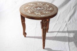 Indian circular hardwood table inlaid with a temple and lions, 45.