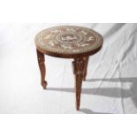 Indian circular hardwood table inlaid with a temple and lions, 45.