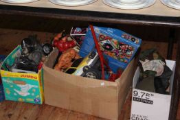 Three boxes of toys, games, military helmet,