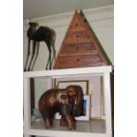 Small four drawer pyramid chest, carved wood elephant, tin model camel,