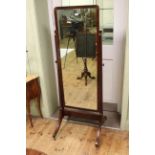 Late 19th Century/early 20th Century mahogany cheval mirror raised on four outsplayed legs,