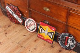 Four cast iron signs including Harley Davidson,