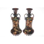 Pair of Continental two handled vases decorated with flowers,