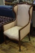 Edwardian mahogany and line inlaid wing back armchair in pink foliate pattern fabric