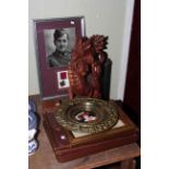 Carved wood dragon, telescope, compass, brass framed circular plaque, engravings,