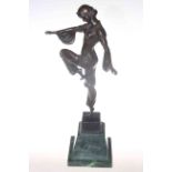 Bronze lady in dancing pose on green marble plinth,
