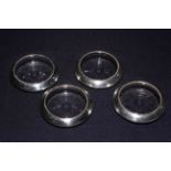 Set of four sterling silver glass coasters