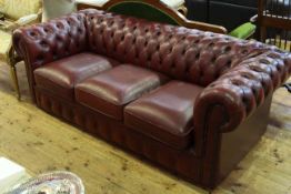 Ox blood deep buttoned leather three seater Chesterfield settee,