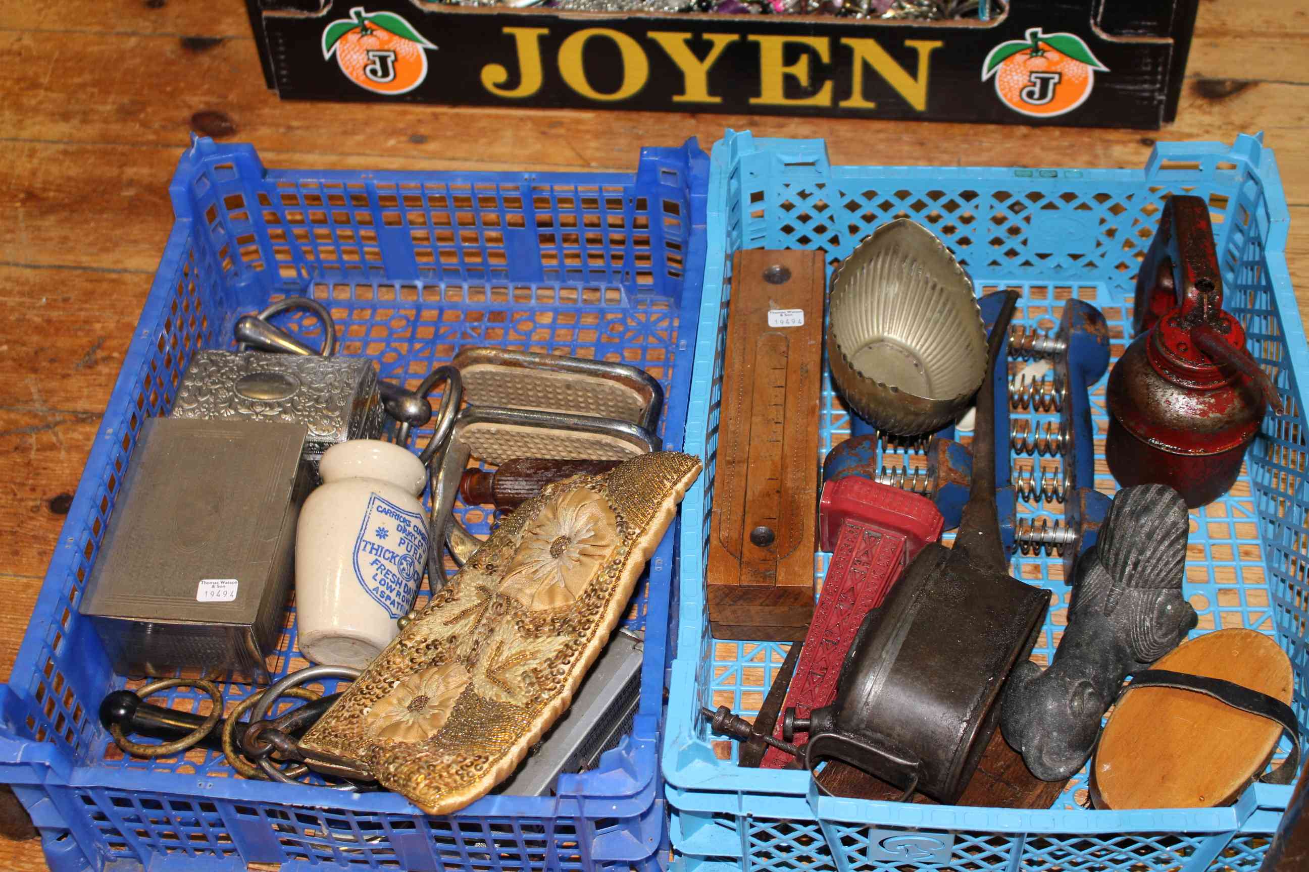 Two boxes of collectables including oil cans, opera glasses, purse,