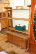 Continental oak cheese press-bookcase having three adjustable shelves above two cupboard doors and