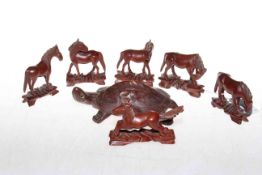 Six carved horses and tortoise