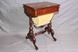 Victorian mahogany two drawer sewing table raised on turned pillars to four scrolled legs, 73.