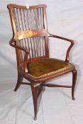 Late 19th Century/Early 20th Century inlaid spindle back open armchair on cabriole legs with cross