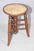 Revolving music stool with turned spindles and registration label