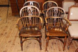 Set of four 19th Century Windsor pierced splat back elbow chairs with crinoline stretchers