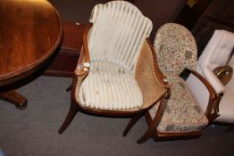 1930's oak armchair and cane panelled occasional armchair (2)