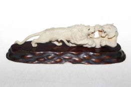 Antique Japanese carved ivory fighting lions,