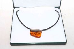 Silver mounted amber pendant,