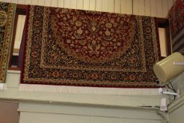 Keshan carpet with a red ground 2.30 by 1.