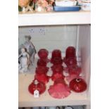 Ten ruby glass shades and two reservoirs