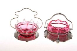 Two cranberry and silver plate baskets,