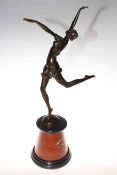 Bronze lady in dancing pose on a marble plinth,