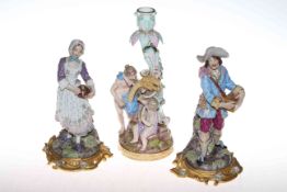 Pair of Continental figures and a Continental figure candle holder,