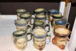 Collection of twelve Kingston Pottery character jugs and a regulator wall clock