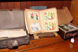 Postcard album, domino set and loose postcards,