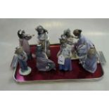 Collection of seven Nao figures,