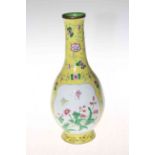 Oriental enamel bottle vase with panels of butterfly and flowers on 'Imperial' yellow ground, 26cm.