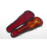 Cased miniature violin.