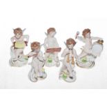 Five Capodimonte cherubs playing instruments, 12cm.