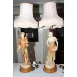 Pair of Royal Dux lamps decorated with pastoral couple, 58cm.