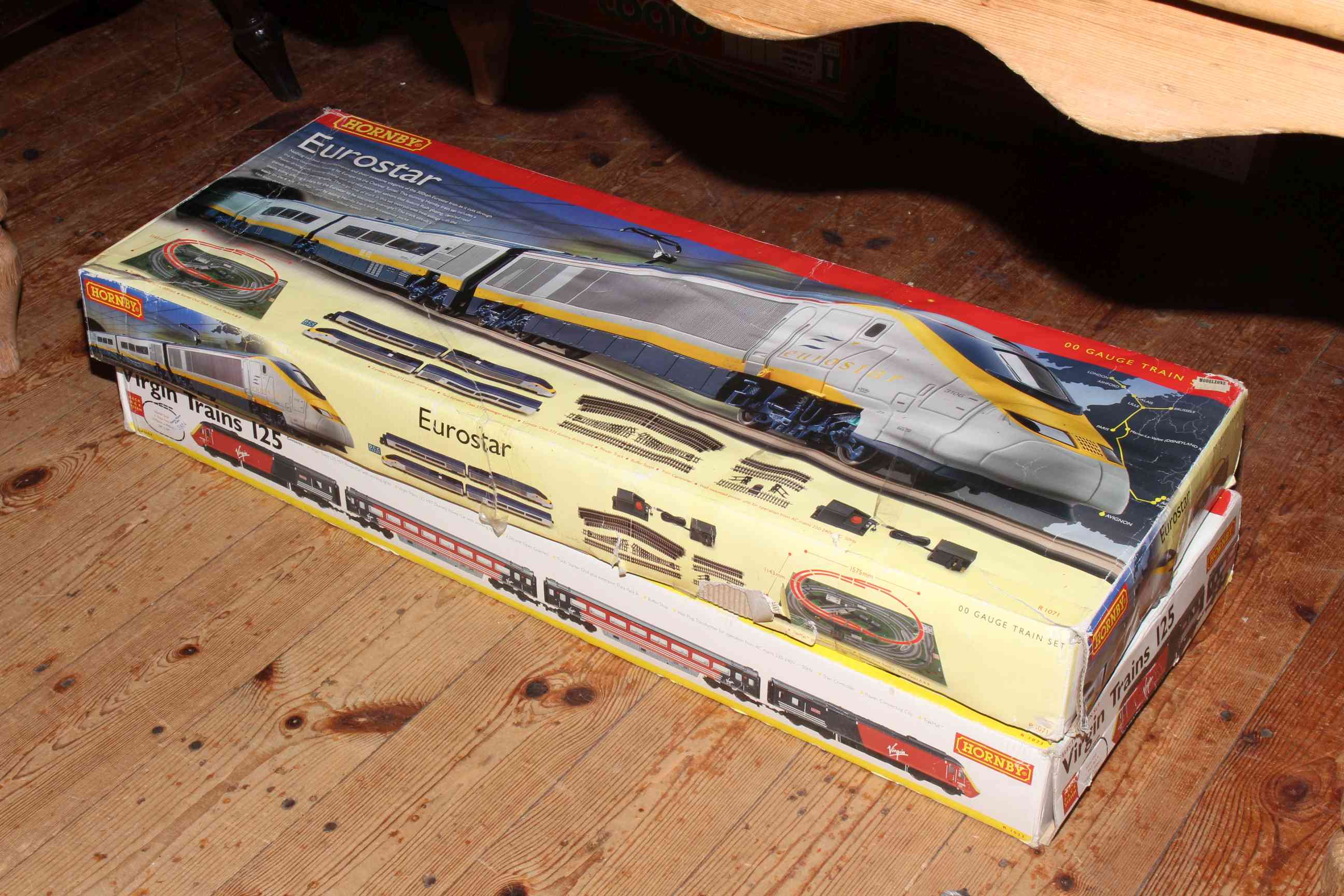 Two boxed modern train sets, Eurostar and Virgin Trains 125.