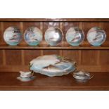 Limoges porcelain eight piece fish service, comprising large oval shaped serving dish,