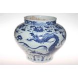 A large Chinese blue and white dragon vase of squat baluster form decorated with four-claw dragon,