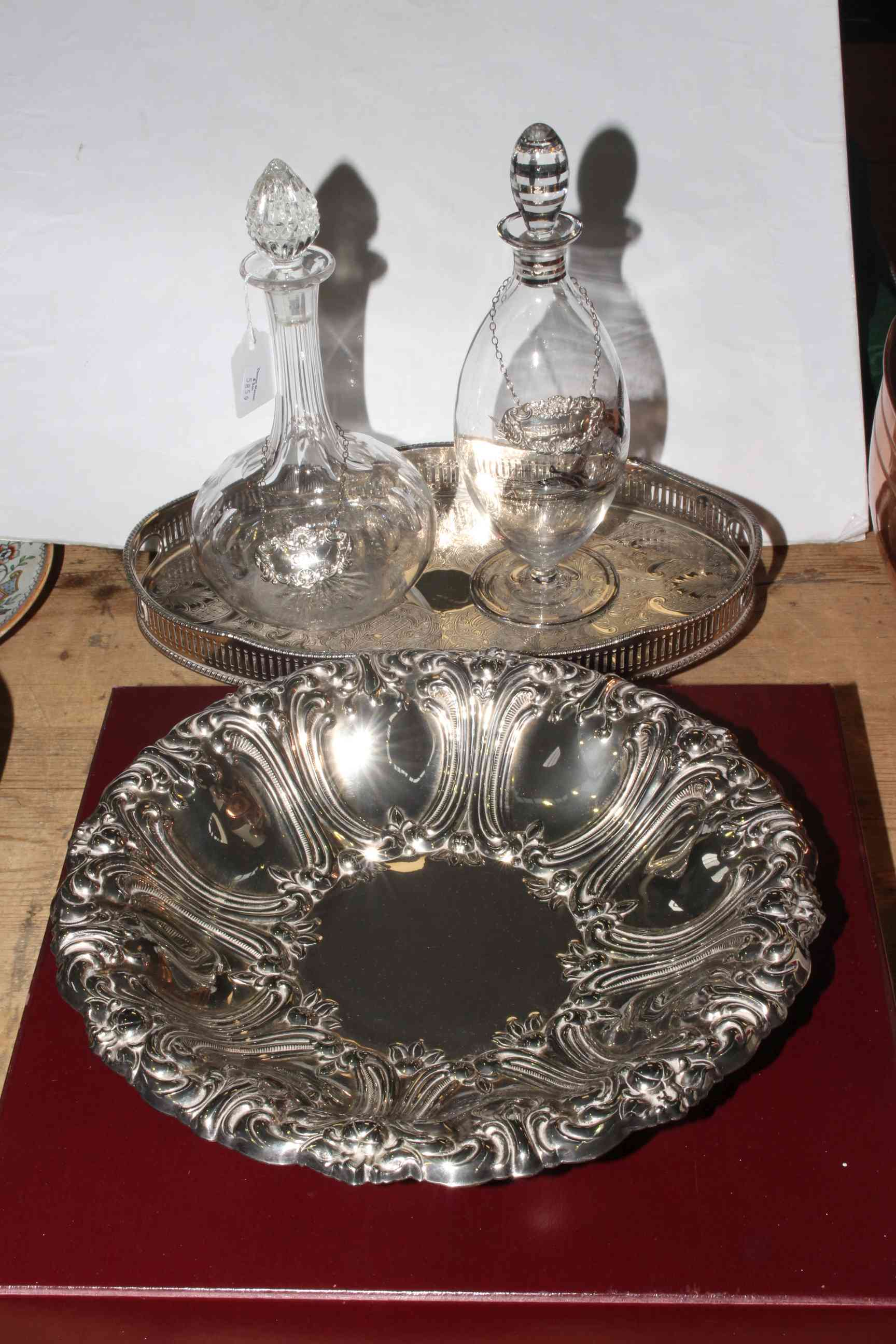 Silver plated tray, two decanters, silver gin and sherry labels and a Walker & Hall bowl in box.