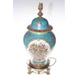 Chinese baluster form table lamp profusely decorated with flowers on mostly blue ground and an