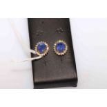 18 carat Yellow Gold Tanzanite and Diamond earrings featuring, 2 oval cut,