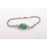 14 carat White Gold Emerald and Diamond bracelet featuring centre, oval cut Emerald (3.