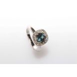 18 carat White Gold Sapphire and Diamond ring featuring centre, round cut,