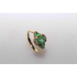 14 carat Yellow Gold Emerald and Diamond ring featuring centre, oval cut, light green Emerald (1.