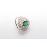 18 carat White Gold Emerald and Diamond ring featuring centre, oval cut, medium green Emerald (0.