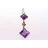 Diamond and amethyst pendant on round link chain.