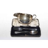Reid and Sons, Newcastle, silver sauce boat, London 1916 and a silver spoon and fork in box,