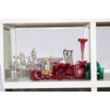 Collection of cranberry, green and clear glassware including spill vase, decanters, cruet, carafe,