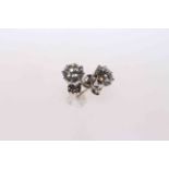 A pair of solitaire diamond earrings, round brilliant cut diamonds in white eight claw settings,