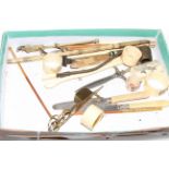 Box of ivory including napkin rings, trinket box, knives.